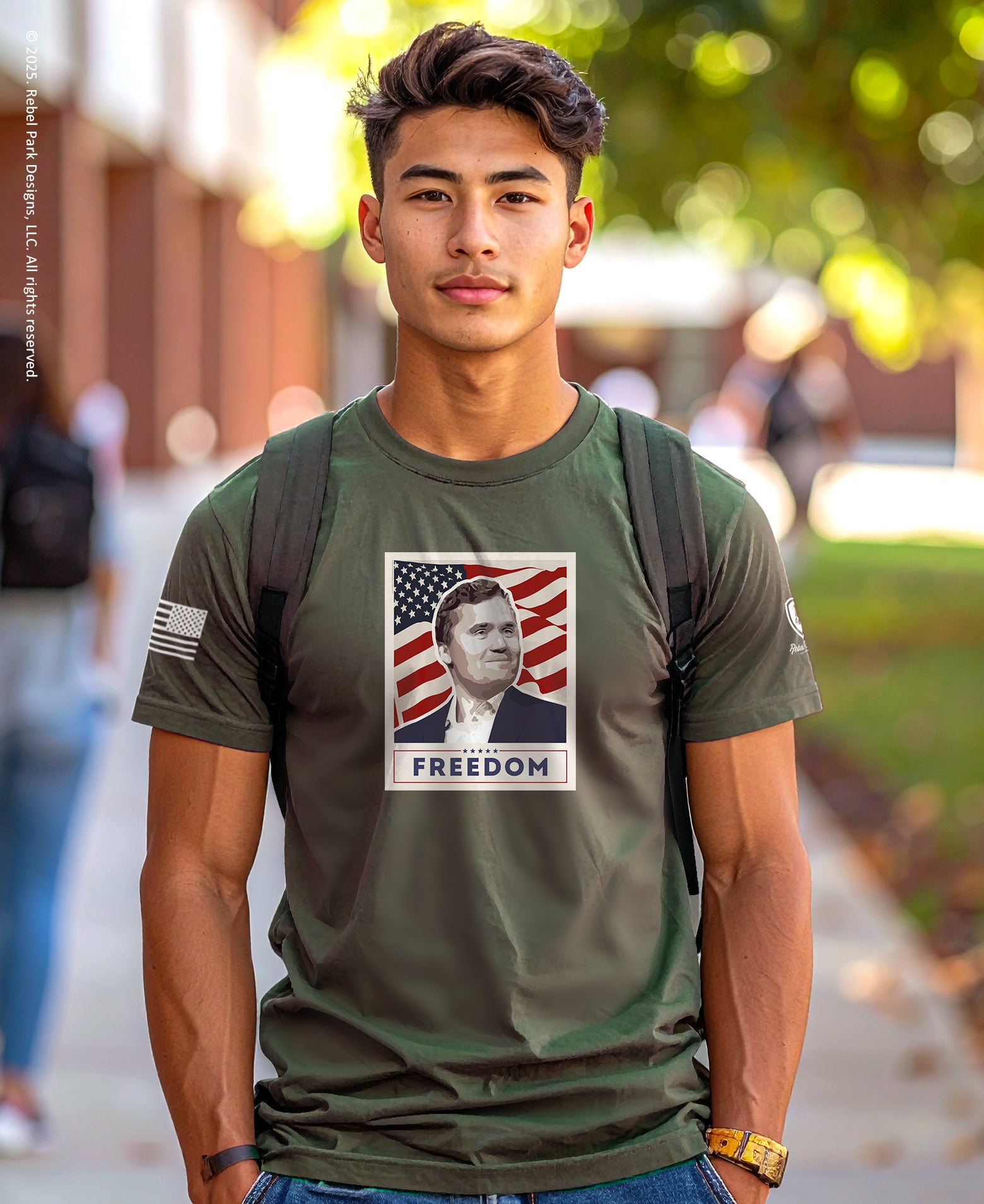 Man wearing a green t-shirt with a graphic design outdoors