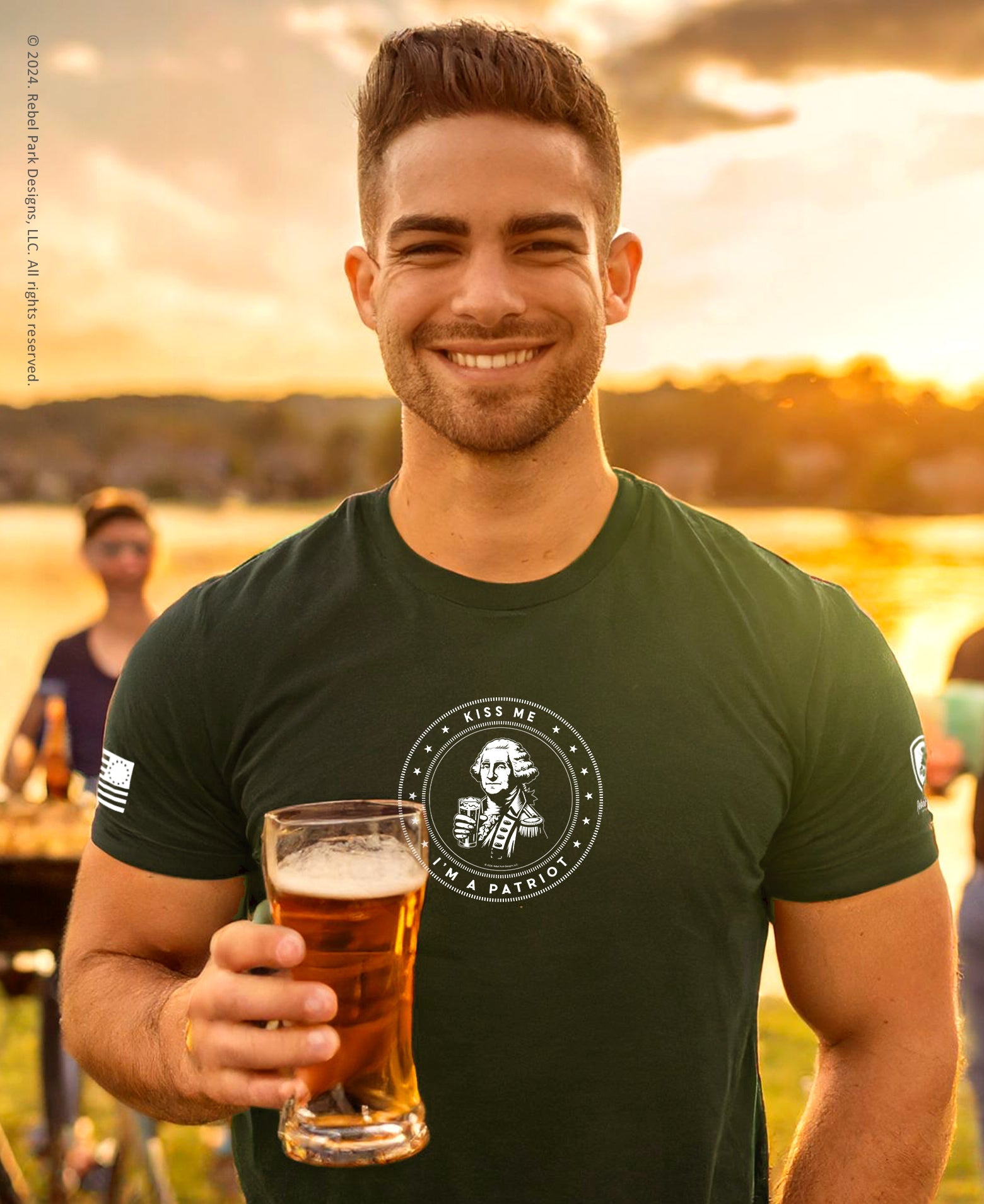 Man holding a beer at sunset with a scenic background