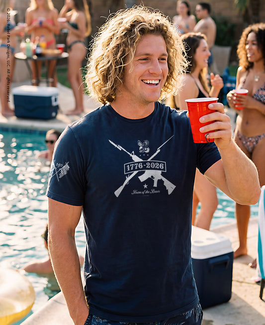 Man holding a red cup by a pool with people in the background