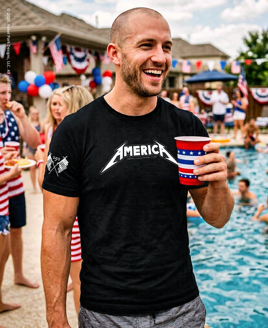 Man wearing a black t-shirt with 'AMERICA' printed on it, holding a red and white cup, standing by a pool with people around.