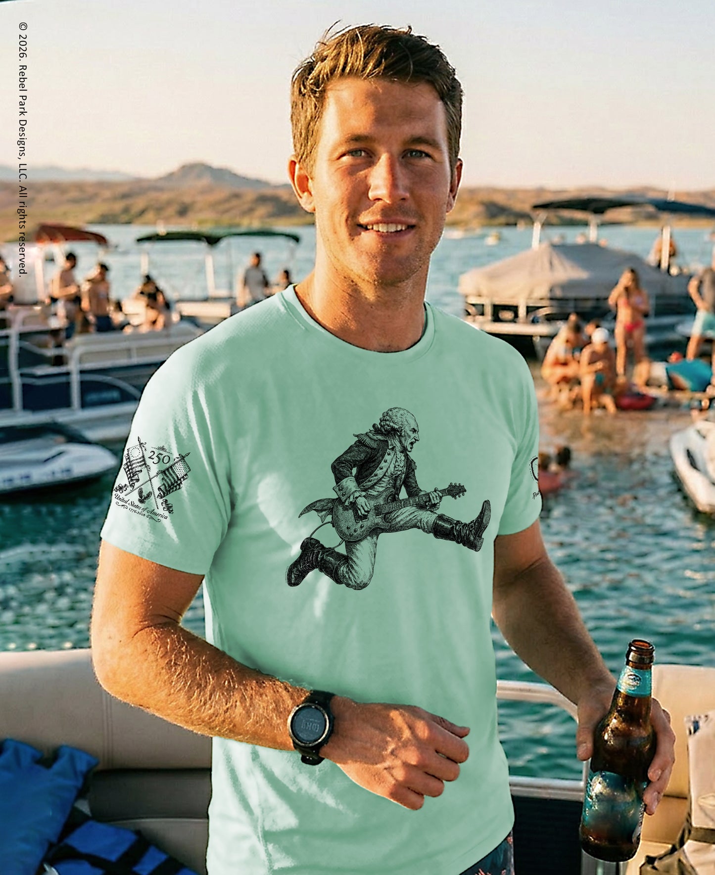 Man on a boat holding a beer, wearing a light green t-shirt with a graphic design, with a scenic background of water and people.