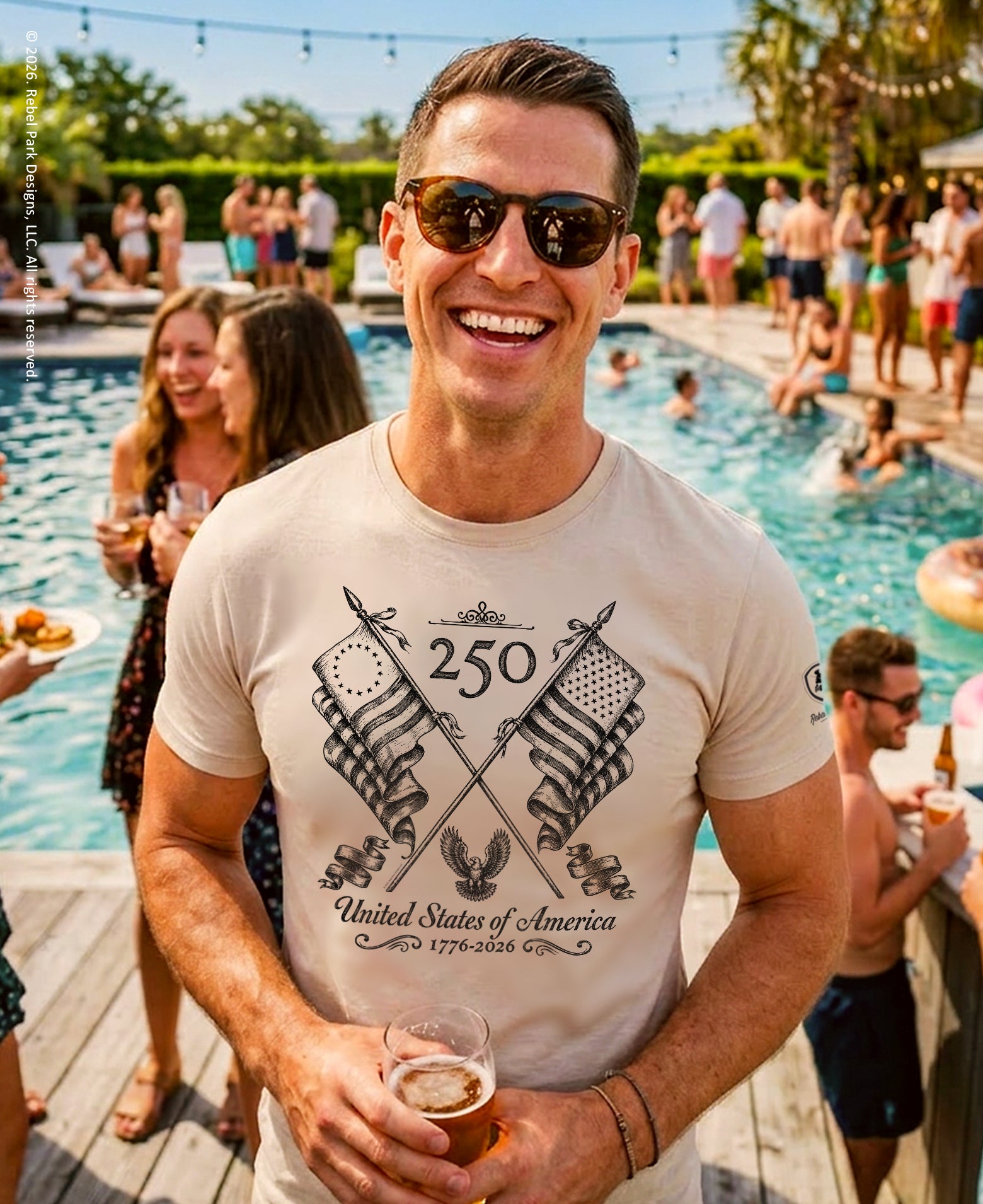 Man wearing sunglasses and a t-shirt with a graphic design, standing by a pool with people around.