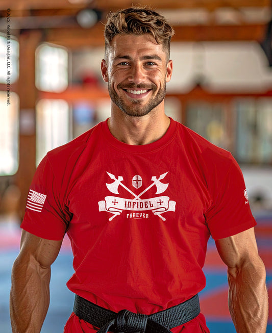 Man wearing a red t-shirt with a logo and text, standing indoors.