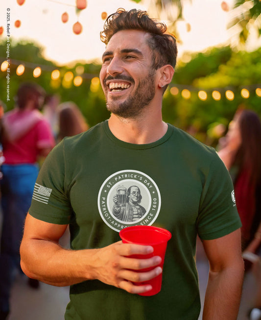 Man at a st. paddy's party holding a red solo cup and wearing a st.paddy's t-shirt