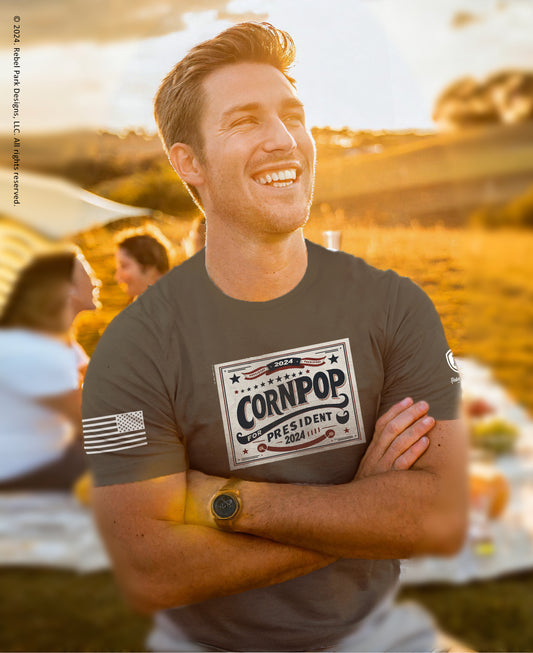 man laughing wearing cornpop t-shirt